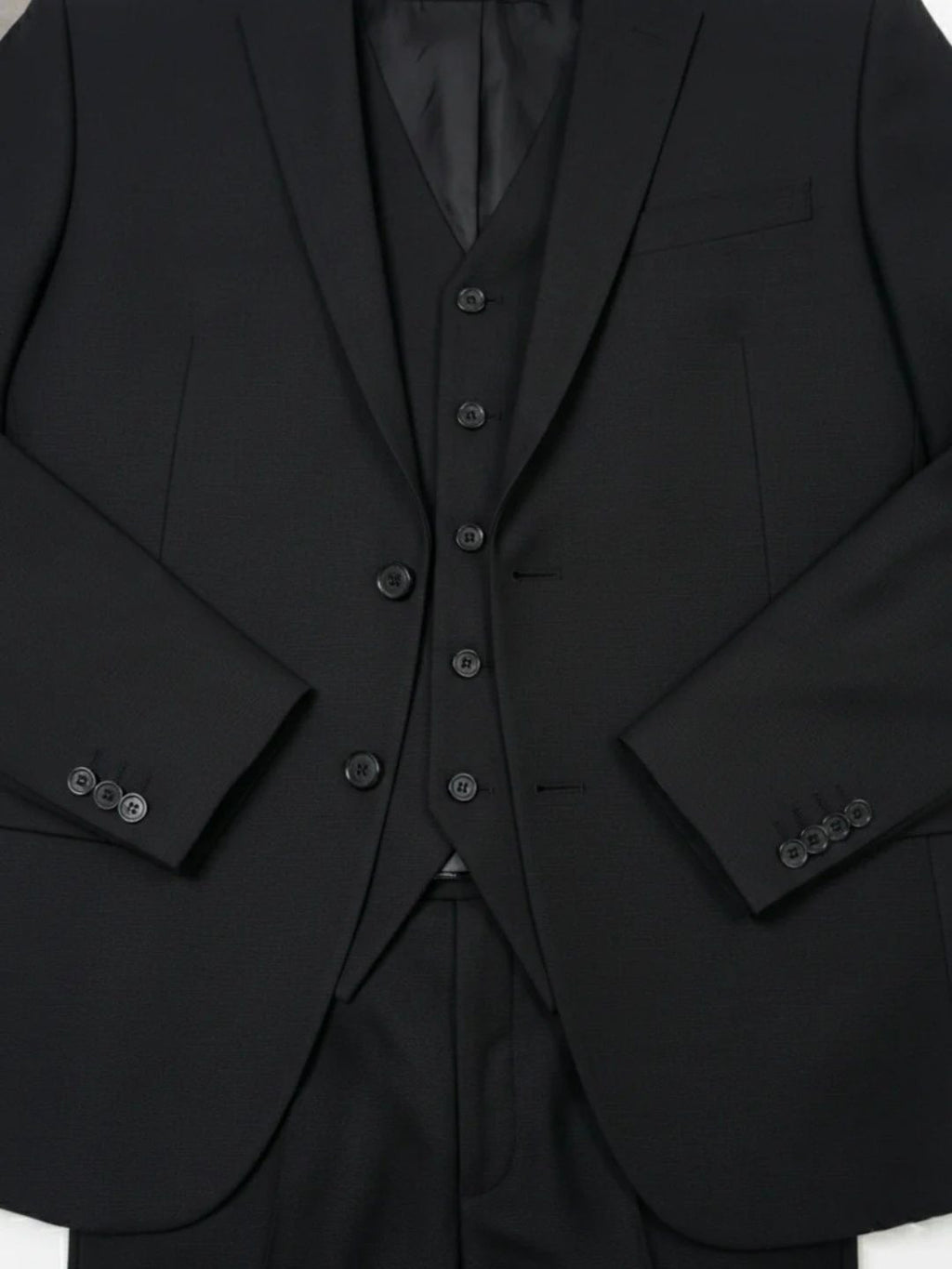The Classic Black Three-Piece Suit